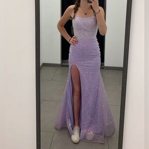 Color is lavender. Super flattering. Love this dress.